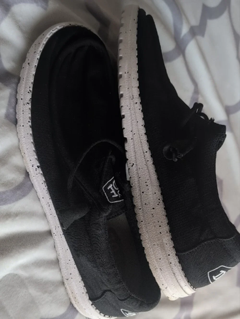 Hey Dude Men's Black Canvas Slip-On Sneakers with White Soles